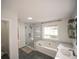 Modern bathroom with a soaking tub, walk-in shower, and dual vanity with under cabinet space at 2019 Chelton Se Way, Smyrna, GA 30080