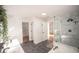 Bright bathroom featuring a double vanity, glass-enclosed shower, and tile floors at 2019 Chelton Se Way, Smyrna, GA 30080