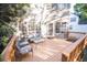 Wooden deck with outdoor seating, views of the yard, and natural light filtering through the trees at 2019 Chelton Se Way, Smyrna, GA 30080