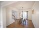 Bright dining room featuring a wooden table, metal chairs, hardwood floors, and a decorative chandelier at 2019 Chelton Se Way, Smyrna, GA 30080