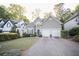 Charming two-story home with landscaped front yard and a two-car garage at 2019 Chelton Se Way, Smyrna, GA 30080