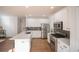 Modern kitchen featuring white cabinets, stainless steel appliances, and a kitchen island at 2019 Chelton Se Way, Smyrna, GA 30080