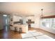 Open kitchen with white cabinets, stainless steel appliances and a large island at 2019 Chelton Se Way, Smyrna, GA 30080