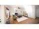 Spacious living room featuring a fireplace, hardwood floors and an area rug at 2019 Chelton Se Way, Smyrna, GA 30080