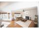 Bright and inviting living room with hardwood floors, fireplace, and natural light at 2019 Chelton Se Way, Smyrna, GA 30080