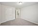 Neutral walls and plush carpet define this adaptable and clean bedroom space at 4680 Hemingway Trl, Cumming, GA 30041