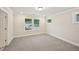 Neutral bedroom with carpet, base trim, crown molding, and natural light from the double windows at 4680 Hemingway Trl, Cumming, GA 30041