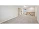 Upstairs bonus room features neutral walls and carpet, plus a peek into another room at 4680 Hemingway Trl, Cumming, GA 30041