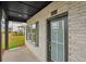 Close-up of a home's front porch featuring a stylish front door and brick siding at 4680 Hemingway Trl, Cumming, GA 30041