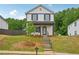 Charming two-story home featuring a classic black and white facade and well-manicured lawn at 4680 Hemingway Trl, Cumming, GA 30041