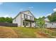 Charming exterior with a welcoming porch and neat landscaping on a sunny day at 4680 Hemingway Trl, Cumming, GA 30041