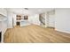 Bright, open-concept space with wood floors and combined living and kitchen area at 4680 Hemingway Trl, Cumming, GA 30041