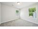 Inviting bedroom with two windows providing ample natural light at 4690 Hemingway Trl, Cumming, GA 30041