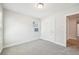 Carpeted bedroom with ample light, featuring two entry ways at 4690 Hemingway Trl, Cumming, GA 30041
