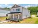 Beautiful two-story home with stone accents, gray siding, and a well-manicured lawn at 4690 Hemingway Trl, Cumming, GA 30041