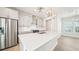 Well-lit kitchen features stainless appliances, a large island, and pendant lighting at 4690 Hemingway Trl, Cumming, GA 30041