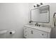 Well-lit bathroom with a white vanity, modern mirror, and stylish fixtures at 315 Mckees Rock Ln, Lawrenceville, GA 30044