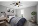 Bedroom is tastefully decorated with a comfortable bed, stylish artwork, and bright, natural light at 315 Mckees Rock Ln, Lawrenceville, GA 30044