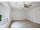 Bright bedroom with neutral colors, carpet, bay window, and ceiling fan at 315 Mckees Rock Ln, Lawrenceville, GA 30044