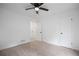 Neutral bedroom featuring carpet flooring, a ceiling fan, and ample natural light at 315 Mckees Rock Ln, Lawrenceville, GA 30044