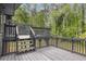 Wooden deck featuring stairs leading to a backyard with mature trees in a fenced area at 315 Mckees Rock Ln, Lawrenceville, GA 30044