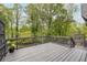 The backyard deck features a wooden rail and stairs leading to another part of the backyard at 315 Mckees Rock Ln, Lawrenceville, GA 30044