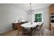 Dining room with sleek furniture, modern lighting and wood floors at 315 Mckees Rock Ln, Lawrenceville, GA 30044