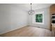 Sun-filled dining area features wood floors and a view to the back yard at 315 Mckees Rock Ln, Lawrenceville, GA 30044
