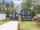 Charming two-story home featuring a modern exterior, well-manicured lawn, and inviting curb appeal at 315 Mckees Rock Ln, Lawrenceville, GA 30044