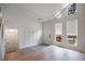 Bright foyer showcasing new flooring, coat rack, and natural light from large windows, and a modern style at 315 Mckees Rock Ln, Lawrenceville, GA 30044