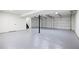 Spacious garage with two doors, a polished floor, and a staircase to the upper level at 315 Mckees Rock Ln, Lawrenceville, GA 30044