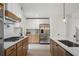 Bright eat-in kitchen features stainless steel appliances, modern cabinets, stone countertops and contemporary lighting at 315 Mckees Rock Ln, Lawrenceville, GA 30044