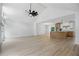 Open concept living area with an island kitchen, new flooring, and plenty of natural light at 315 Mckees Rock Ln, Lawrenceville, GA 30044