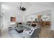 Staged living room showcasing an open layout with an island kitchen, modern furniture and stylish decor at 315 Mckees Rock Ln, Lawrenceville, GA 30044