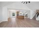 Open concept living area with an island kitchen, new flooring, and plenty of natural light at 315 Mckees Rock Ln, Lawrenceville, GA 30044