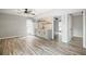 Open-concept living area with wood-look flooring and stylish wet bar is perfect for entertaining at 315 Mckees Rock Ln, Lawrenceville, GA 30044