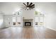 Spacious living room boasting vaulted ceiling, fireplace, and large windows for ample natural light at 315 Mckees Rock Ln, Lawrenceville, GA 30044