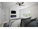 Cozy bedroom features electric fireplace, fan, window seat, carpeted floors and neutral colors at 315 Mckees Rock Ln, Lawrenceville, GA 30044