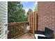 Balcony features a brick wall, wood railing, and an outdoor seating area at 5523 Glenridge Ne Park, Atlanta, GA 30342
