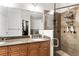 Bathroom with double sink vanity and a tiled walk-in shower with a shower head at 5523 Glenridge Ne Park, Atlanta, GA 30342