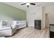 Bedroom with white crib, rocking chair, and laminate floors at 5523 Glenridge Ne Park, Atlanta, GA 30342
