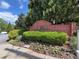 Welcoming entrance sign for Glenridge Creek Townhomes surrounded by vibrant landscaping at 5523 Glenridge Ne Park, Atlanta, GA 30342