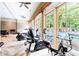 The gym features various equipment and scenic views of the pool and outdoors at 5523 Glenridge Ne Park, Atlanta, GA 30342