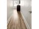 Hallway with wood-look floors leading to the entry way and other rooms at 5523 Glenridge Ne Park, Atlanta, GA 30342