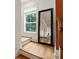 Hallway with staircase, hardwood floors and a framed mirror on the landing at 5523 Glenridge Ne Park, Atlanta, GA 30342