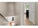 Hallway staircase with a view into another room and window at 5523 Glenridge Ne Park, Atlanta, GA 30342
