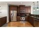 Kitchen featuring dark cabinets, stainless steel appliances, and granite countertops at 5523 Glenridge Ne Park, Atlanta, GA 30342