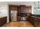 Modern kitchen featuring stainless steel appliances and brown cabinetry at 5523 Glenridge Ne Park, Atlanta, GA 30342