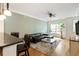 Bright living room with hardwood floors, a ceiling fan, and natural light from the windows at 5523 Glenridge Ne Park, Atlanta, GA 30342
