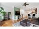 Inviting living room with hardwood floors, a ceiling fan, and an open layout to the kitchen at 5523 Glenridge Ne Park, Atlanta, GA 30342